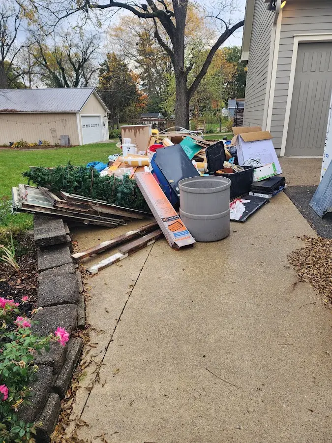 Dumpster being loaded with debris for 30 Yard Dumpster Rental in Huber Heights
